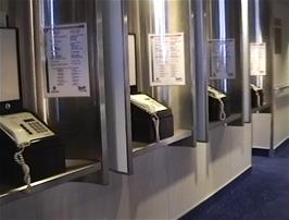 A row of public telephones on the MS Color Viking, for those who need to call and don't mind the cost
